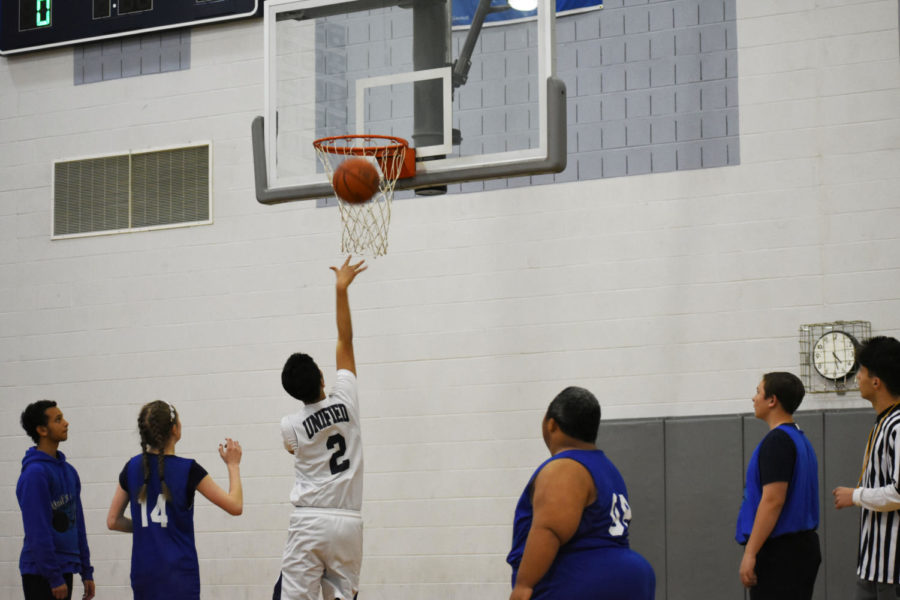 Senior Andre Beeton Torres drives to the basket to make a lay up.