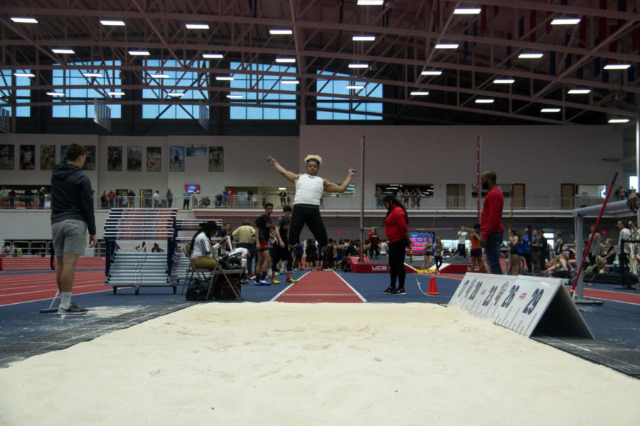 Senior Micah Yutzy competes in long jump against other high schools from Virginia. 
