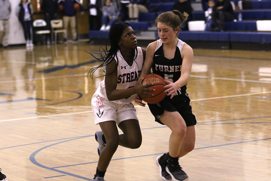 Sophomore Calayiah Stuart goes up for the layup but is wrapped up by a defender. The Streaks went on to win the game. They face Fort Defiance on Friday, Dec. 21.