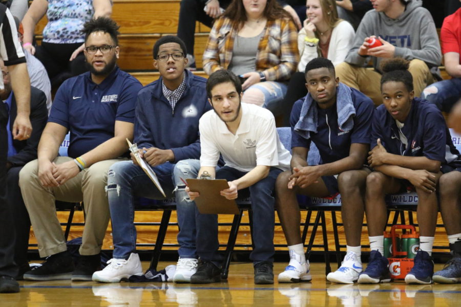 Senior Pana Muhamad (middle) watches the Streaks trail to John Handley. The Streaks lost 51-44.