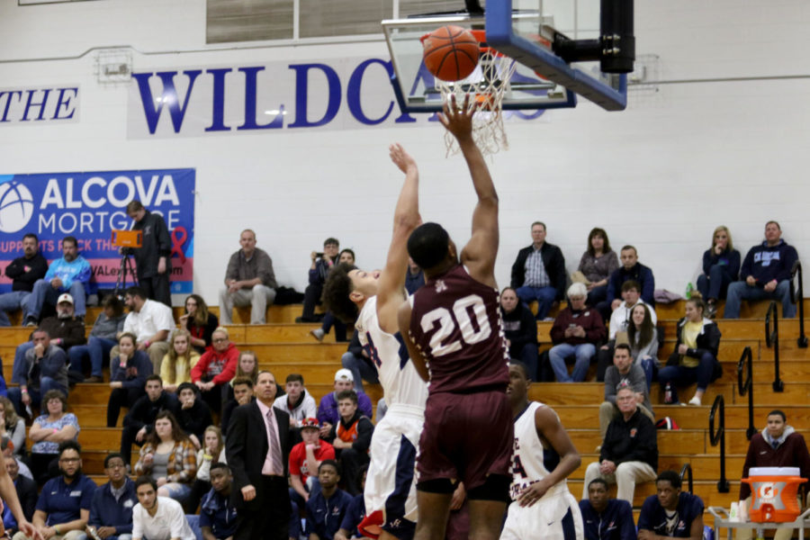 Junior Dshawn Fields goes up to block a shot.