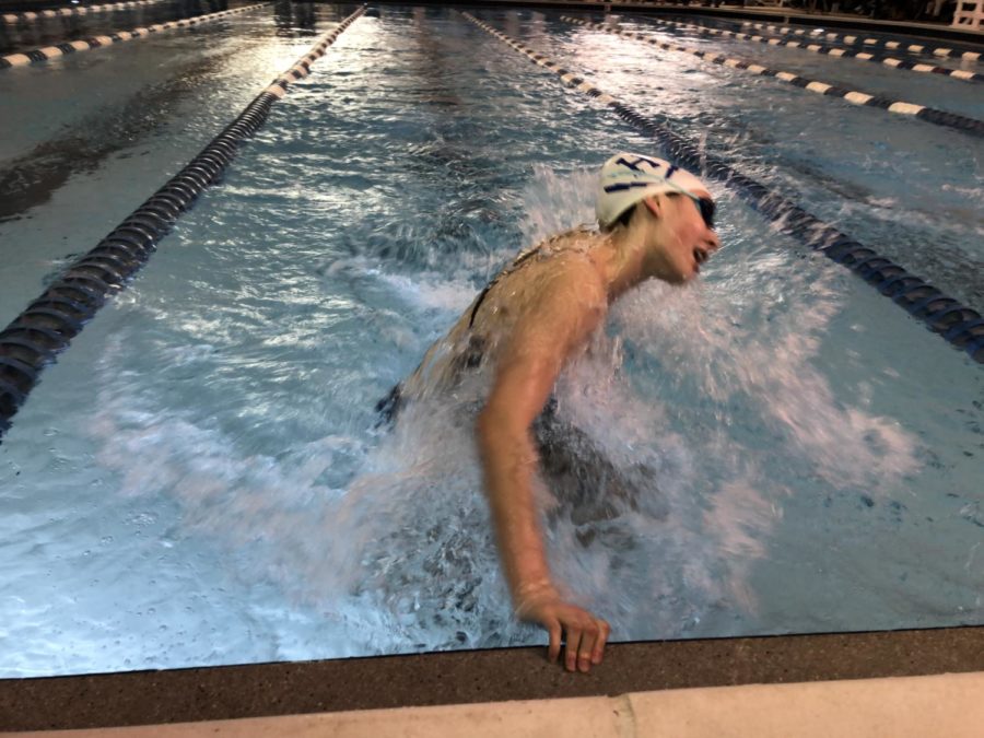 Junior Lily Gusler does her turn going into the second length of her 200 Individual Medley race. 