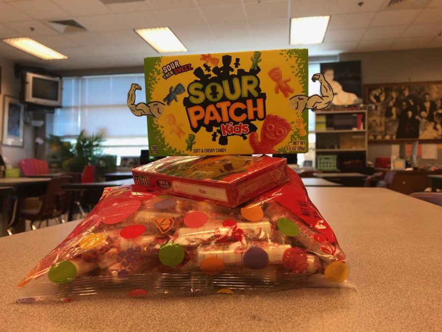 Sour Patch Kids stands triumphantly over other candies. 