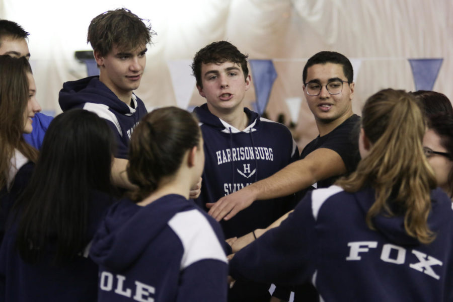 Senior James Henderson (center) leads the seniors in a cheer after their recognition at senior night.