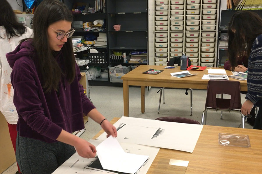 Senior Julia Inouye works in the combined Art 4 and AP Art class. Seniors may take either class depending on their desired workload.