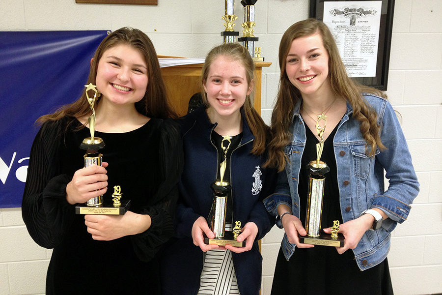 Sophomore Stella Alexiou, sophomore Emma Lankford and freshman Kate Kirwan won trophies at Tournament of Champions, a smaller tournament that took place a few weeks before regionals.
