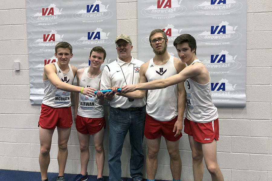 From left: The boys 4x800 meter relay consists of junior Tucker McGrath, sophomore Hayden Kirwan, senior Alex Hulleman and sophomore David Beck. Coach Jerry Hertzler is in the middle.