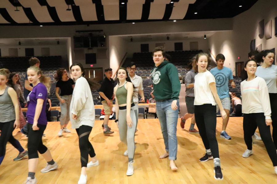 The actors practice their steps for an Irish step dance.