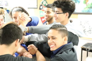 Senior Alex Rodriguez participates in the human knot icebreaker activity. Throughout the Ernie G Leadership Workshop, students worked on getting comfortable with each other through games and warmups. 