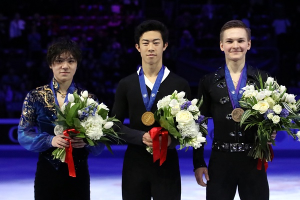 Nathan Chen, center, receives his medal at the 2018 World Championships Podium. Chen is the youngest U.S. male skater to win the Grand Prix of Figure Skating Final. 