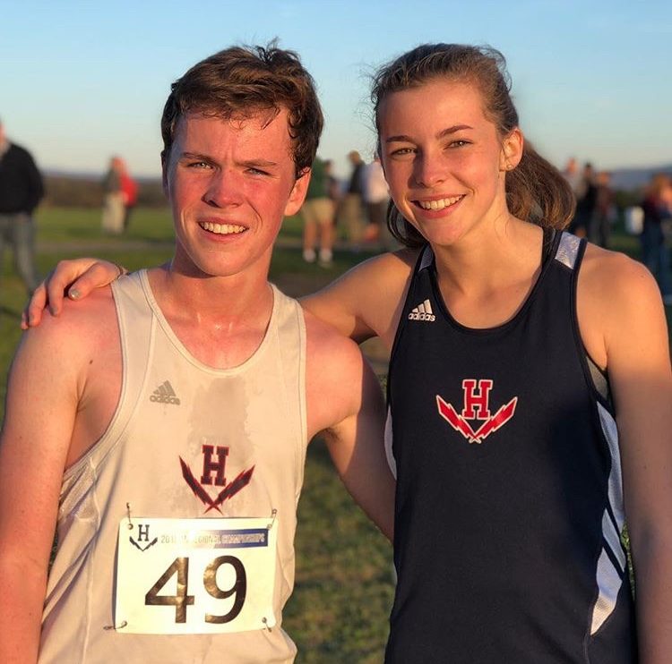 Sophomore Hayden Kirwan and freshman Kate Kirwan meet after a cross country meet. From being in the debate classroom to running side by side, the Kirwans would call their sibling relationship a close one. 