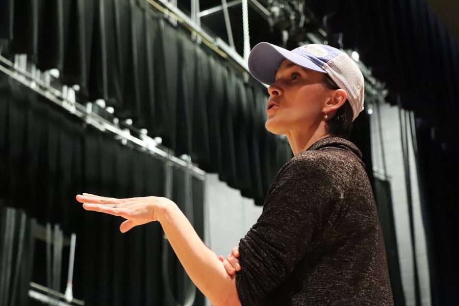 Amber Corriston directs ensemble members during a rehearsal of the schools musical Legally Blonde.