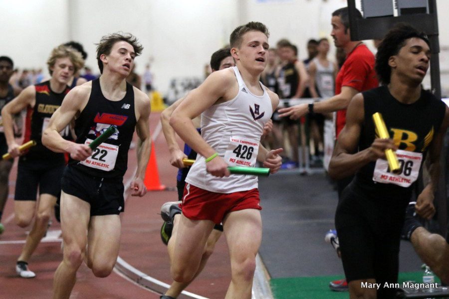 Junior Tucker McGrath fights through the pack of the first leg at the VHSL Class 5 State Competition.