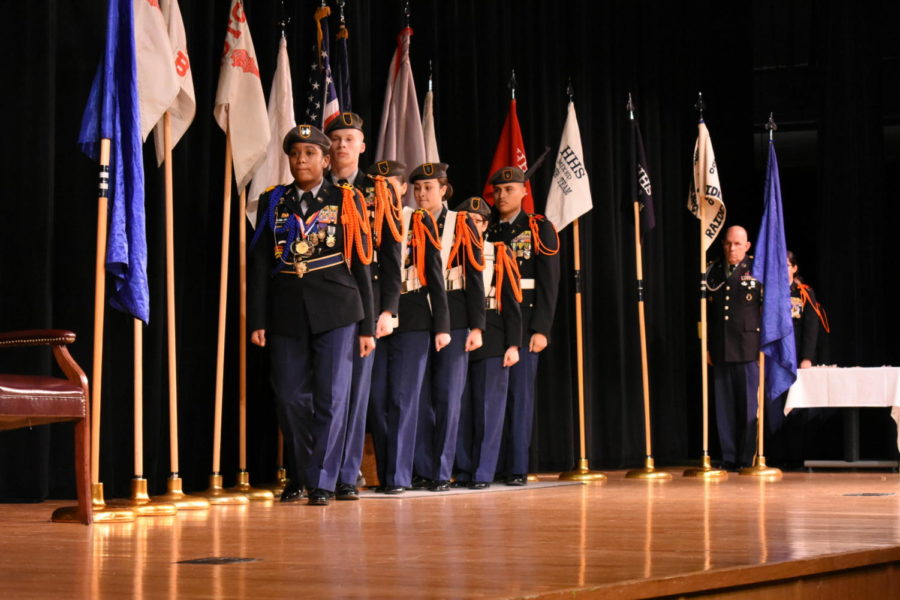 The honor guard marches offstage as the ceremony ends.