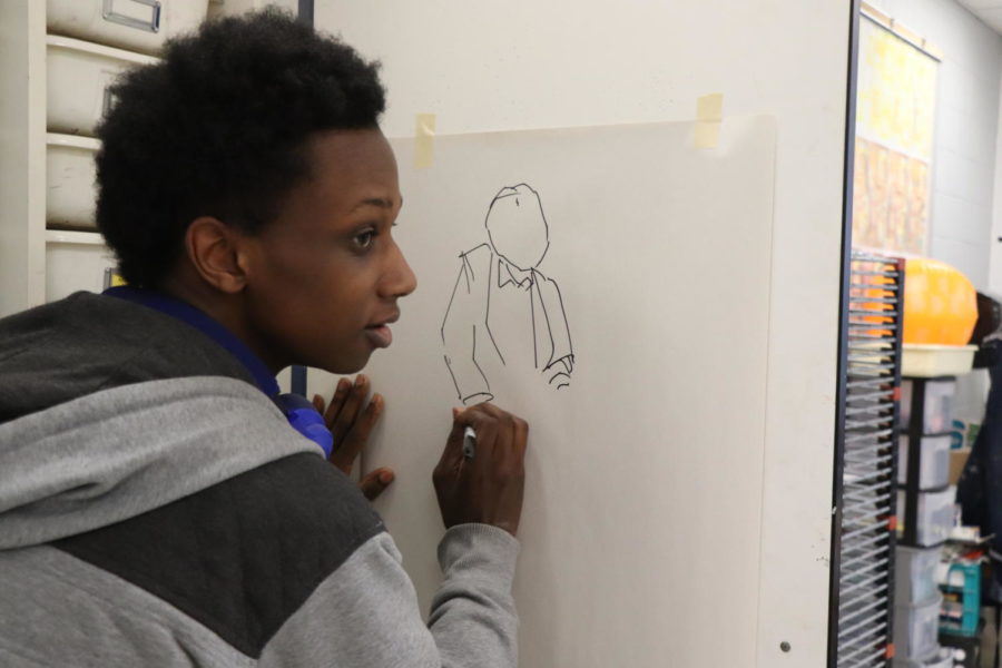 Senior William Walker begins to draw a character for one of his art pieces. Walker previously attended Baltimore School for the Arts before transferring to HHS. 