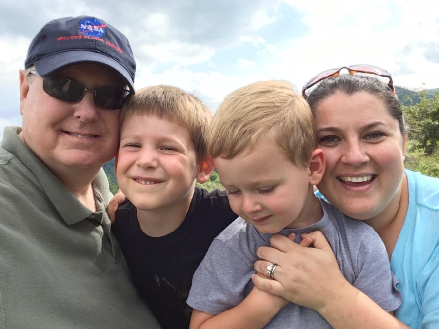 English teacher Sara Gingras takes a selfie with her husband Dan and two sons, Sam and Christopher. Gingras husband, Dan, passed away in 2018 due to vasculitis, an autoimmune disease that involves the inflammation of the bodys blood vessels. 