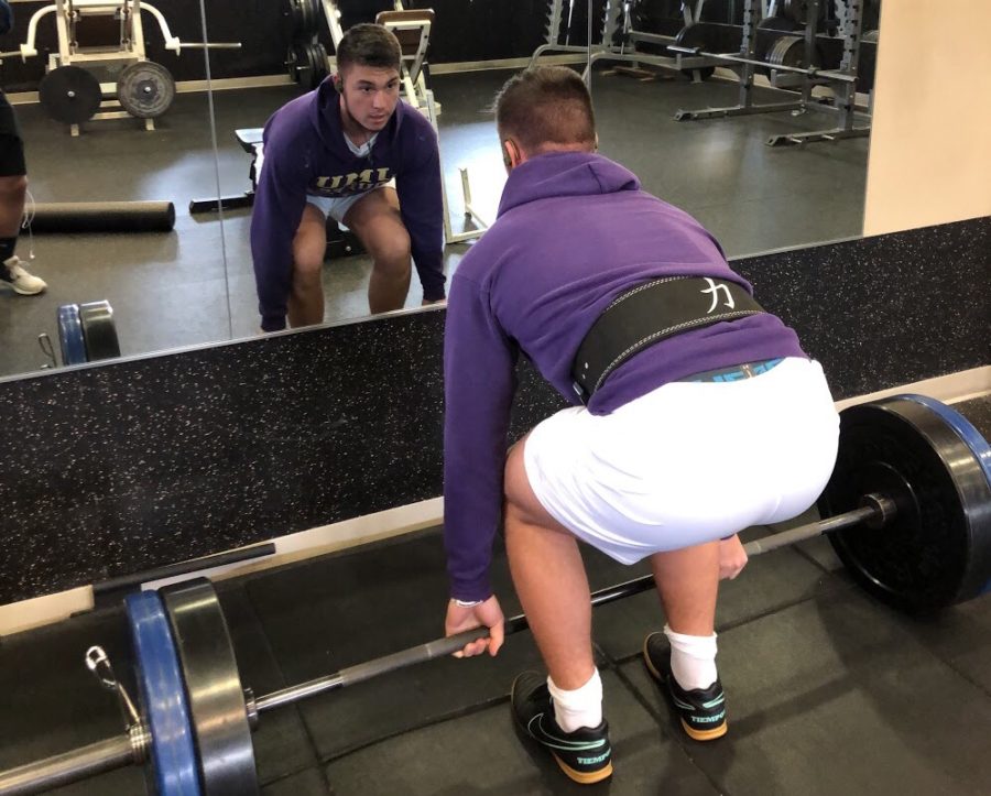 Junior Mateo Peric warms up for lifting by taking on the deadlift. Peric is competing in a powerlifting competition and hopes to place first where he will move onto states. Gains happen overtime, not overnight, Peric said. 