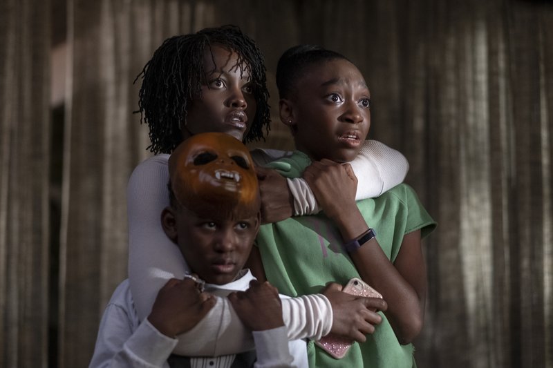 Lupita Nyongo, Shahadi Wright Joseph and Evan Alex as Adelaide, Zora and Jason Wilson in the film Us.