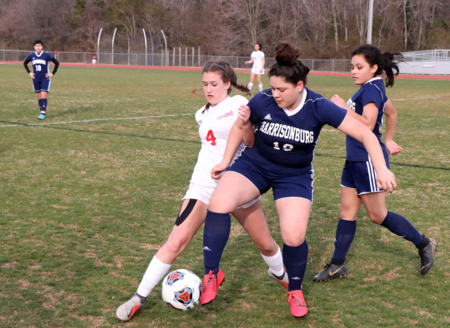 Sophomore Leslie Mondragon attempts to get the ball past a Fauquier defender.