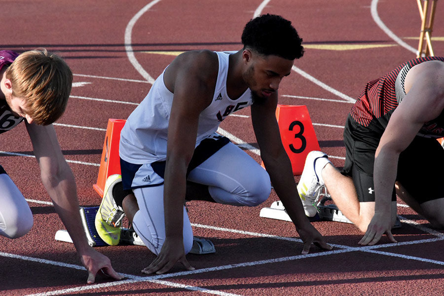 Senior Victor Lynch gets ready for the 100 meter dash.