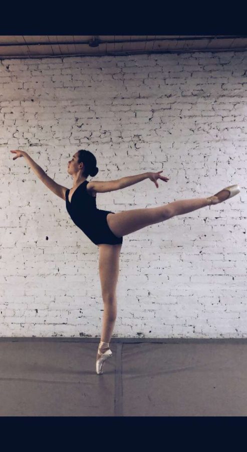 Freshman Maya Pope holds a ballet pose. She hopes one day to become a professional ballet dancer. 