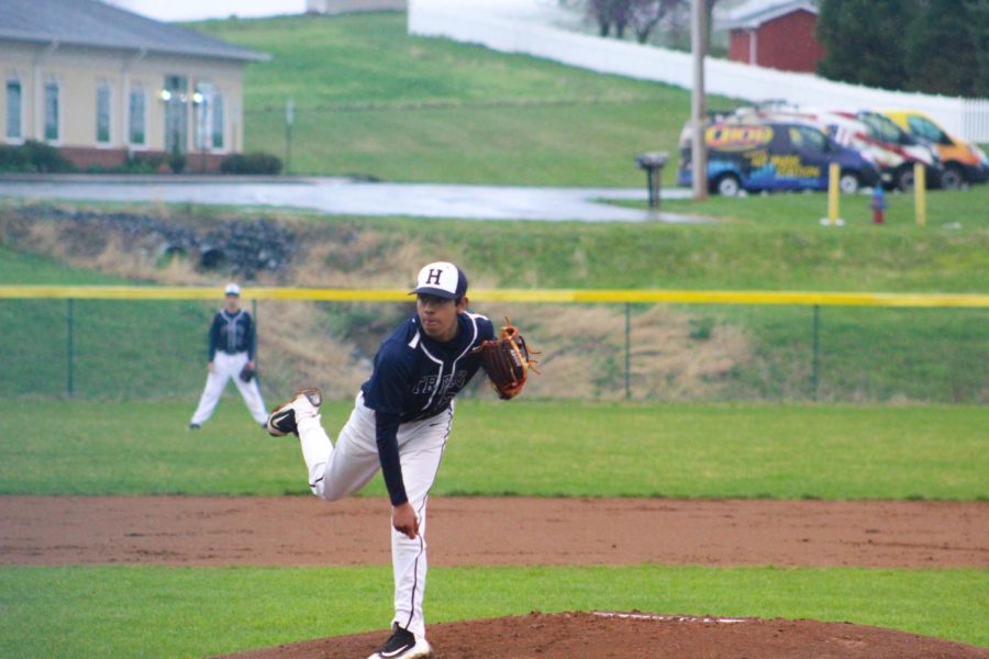 Sophomore Diego Gallegos delivers a pitch during the early stages of the game.