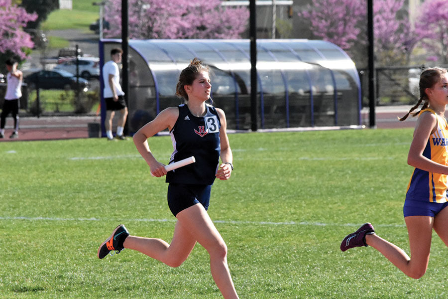 Senior Abby Campillo runs her leg of the 4x800 relay.