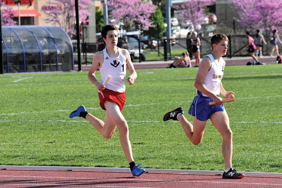 Sophomore David Beck closes the gap between Harrisonburg and Western Albemarle in the final leg of the 4x8.