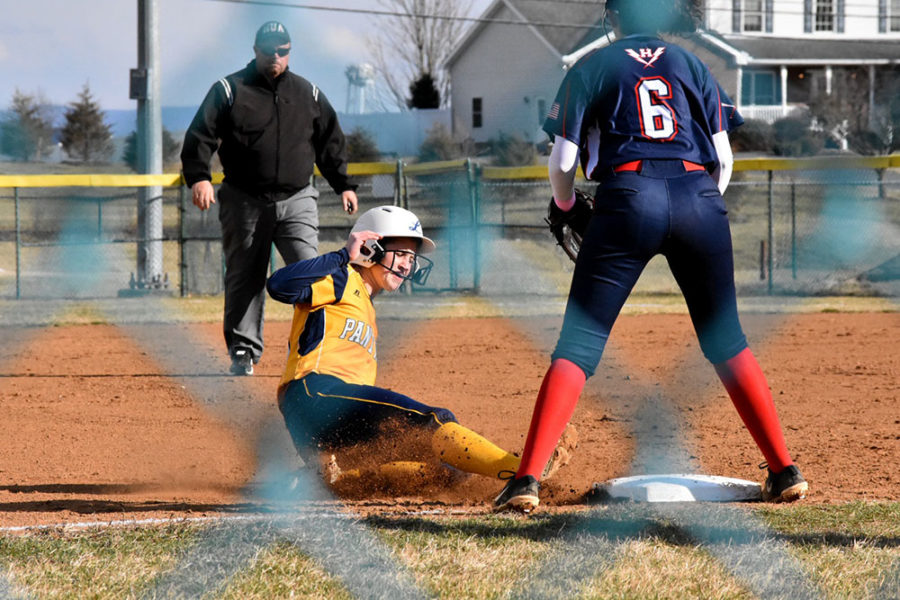 Sophomore Alyssa Sutton awaits the ball as the opposing team slides to the plate.