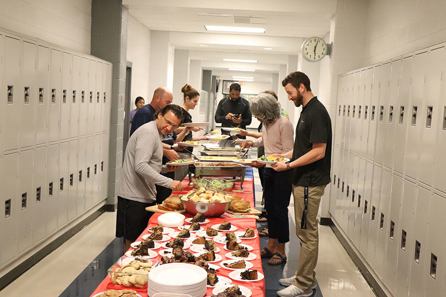 The Physical Education teachers all came down together to grab food.