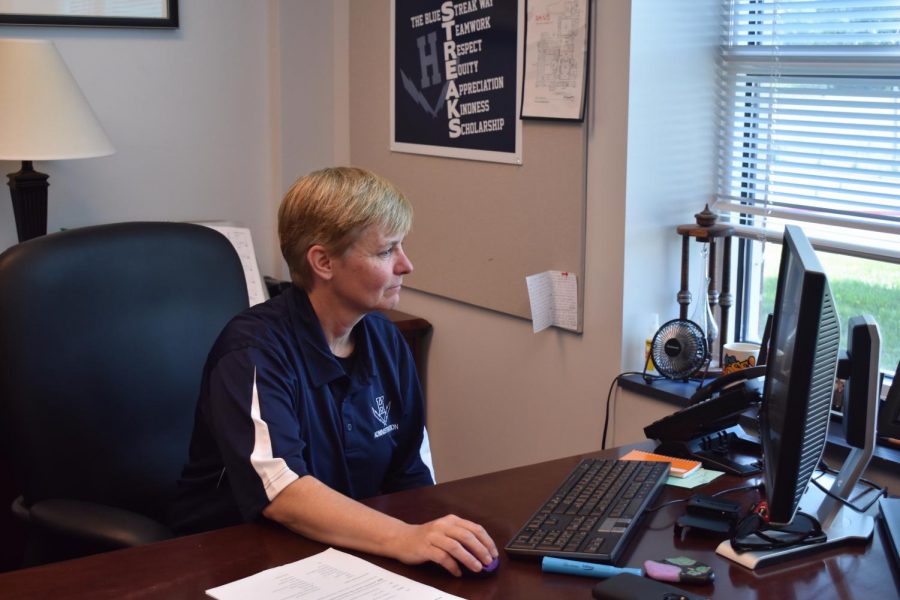 Melissa Hensley works on her computer during her first week as new principal of HHS in summer 2019. 