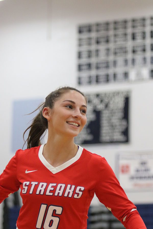 McCollum smiles as she runs at the begining of the game.