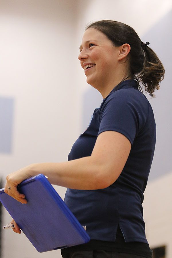 Coach Hannah Bowman Hrasky smiles as she coaches her team.