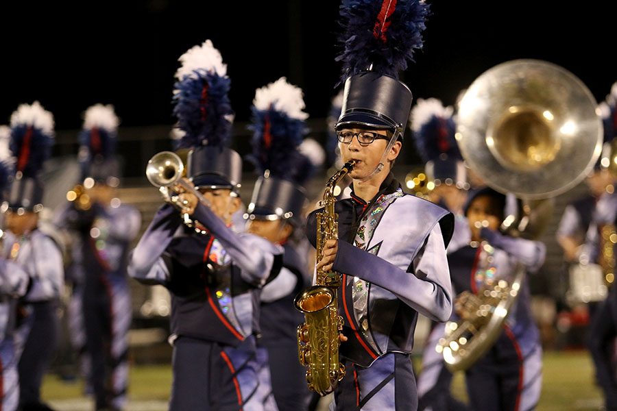 Senior+Isaac+North-Sandel+performs+during+halftime+on+Sep.+20.+This+marked+marching+bands+second+performance+of+the+year+and+the+first+with+new+uniforms+and+props.+