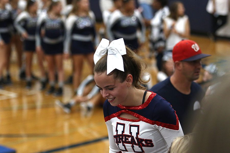Sophomore Clara Miller smiles after completing the routine.