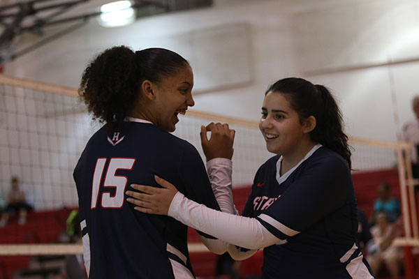 Sophomore Jay Garcia subs into a volleyball game for junior Maddie Shanholtz. The bond created by team sports like these is something that can last a lifetime.