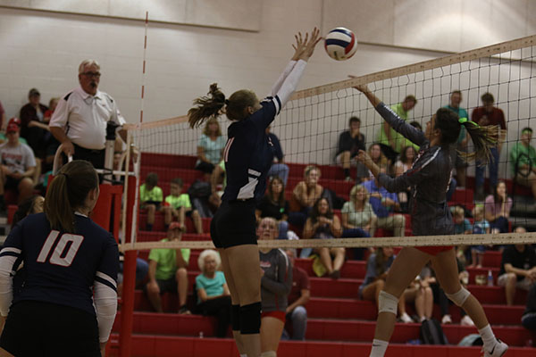 Junior Amelia Mitchell blocks the ball resulting in  point for their team.