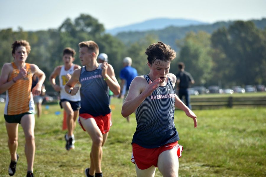 Junior Hayden Kirwan sprints the final stretch of the Varsity A boys race. Kirwan finished 28th overall and first for the boys team, with a personal best of 17:31. 