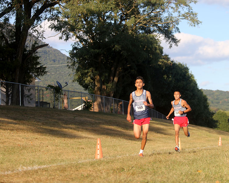 Freshman Niranjan Aradhey finishes in 8th place, followed by junior Jeremias Domingo in 9th.