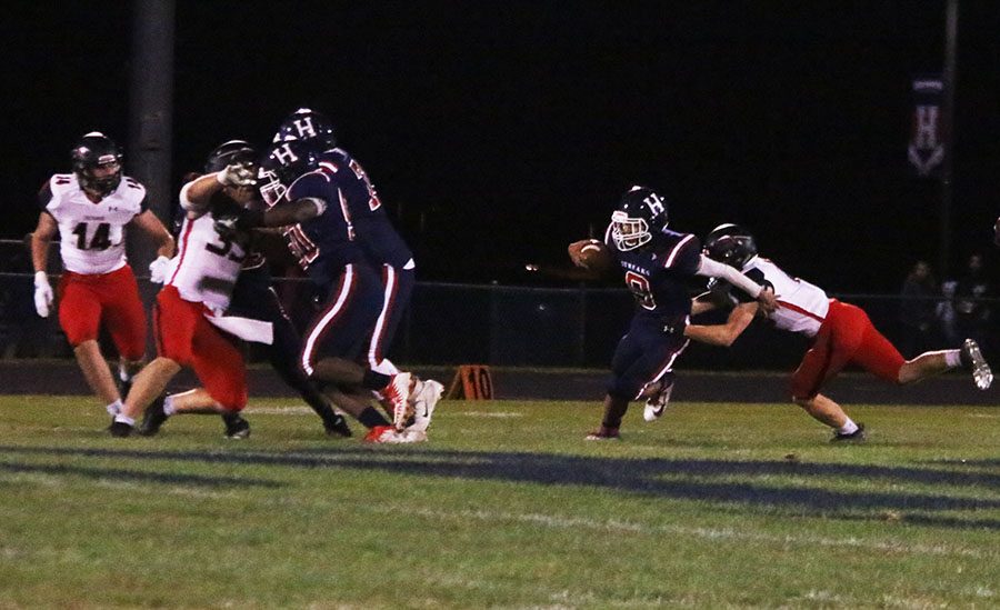 Senior Kwentin Smiley (#9) attempts to break a tackle during a run.