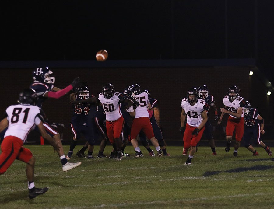 Senior Malachi Davis (#3) goes for a catch during an offensive attack.