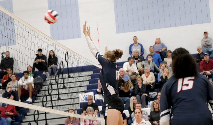 Junior Amelia Mitchell jumps up for a block. 