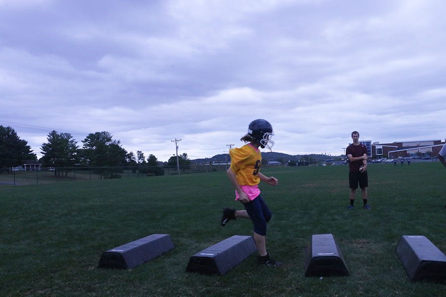 Eighth grader Charlie Blair III finishes out the drill.