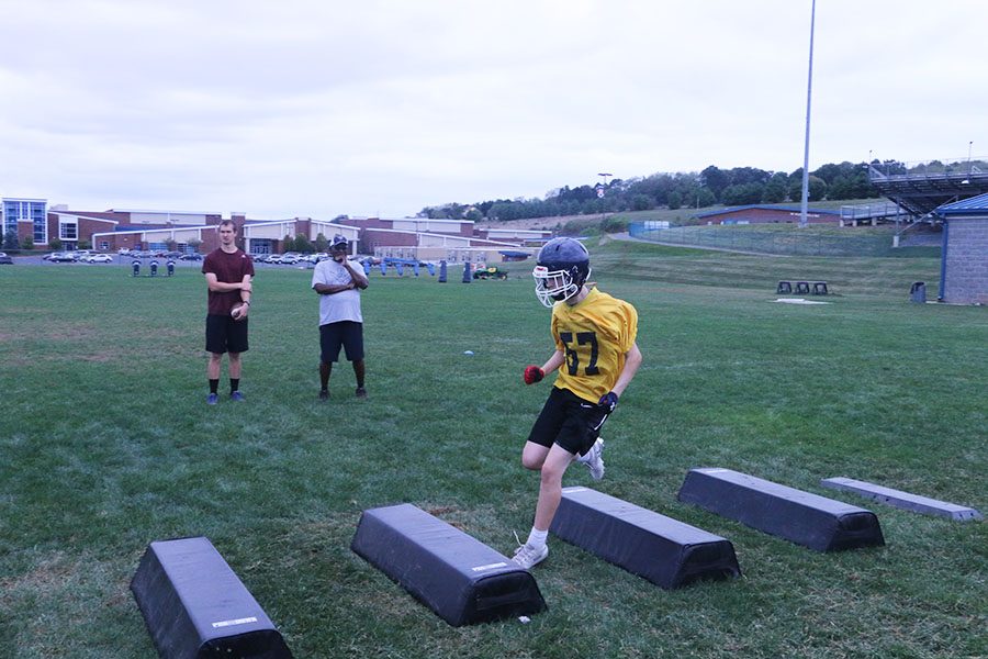 Freshman Wide Receiver and Team Captain Drew Bowman builds up speed while focusing on his footwork.