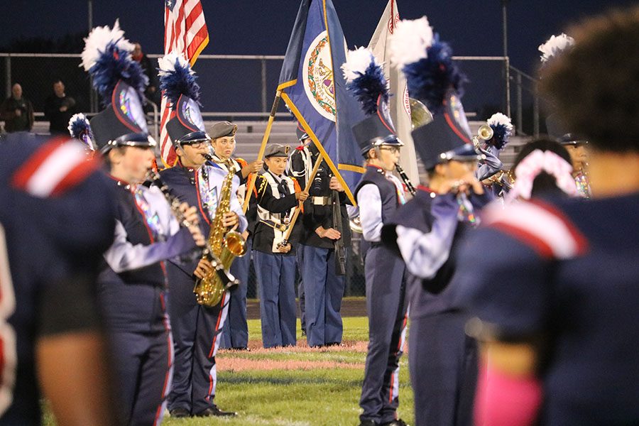 The HHS band plays the national anthem while JROTC present the nations colors.