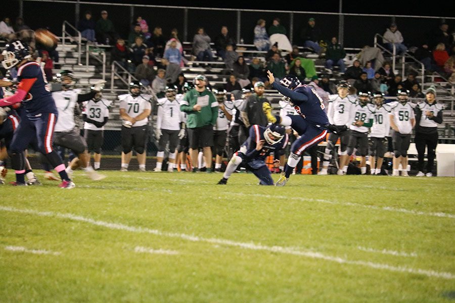 Senior Mateo Peric (#17) kicks the extra point after the Streaks scored a touchdown.