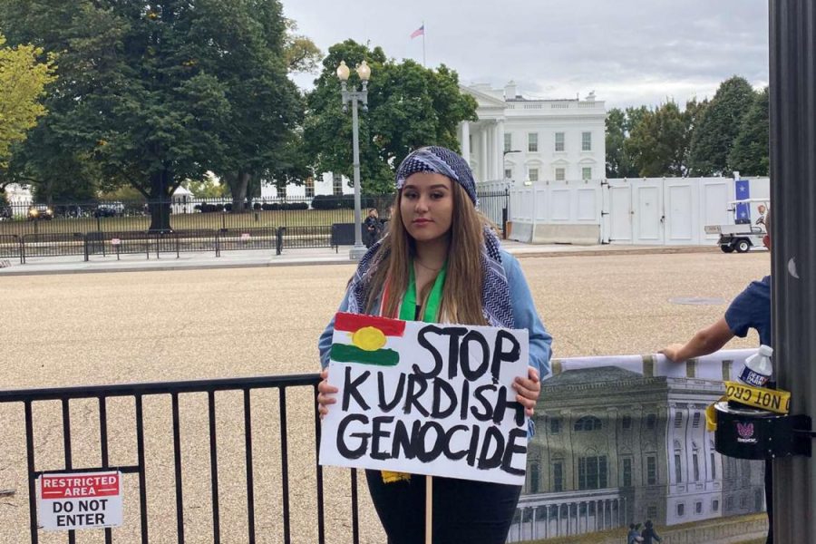 Senior Skala Barakay holds a sign up in front of the White House during the Kurdish protest.