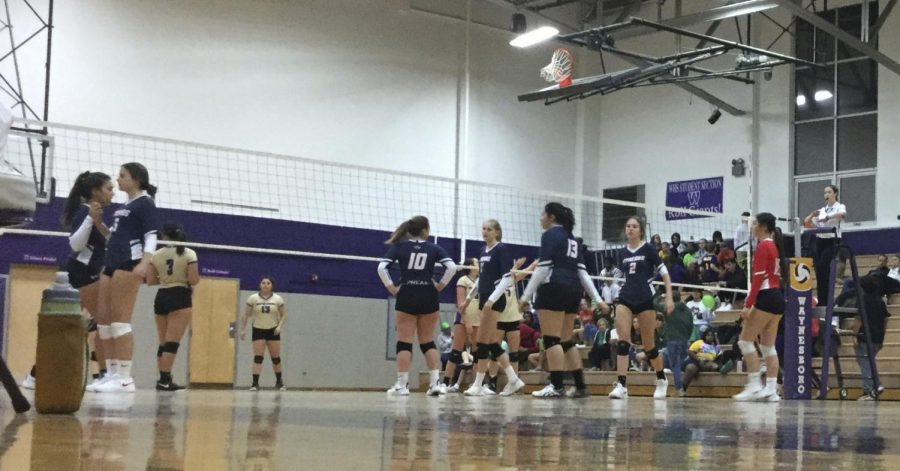 Varsity volleyball gets ready to begin the set 