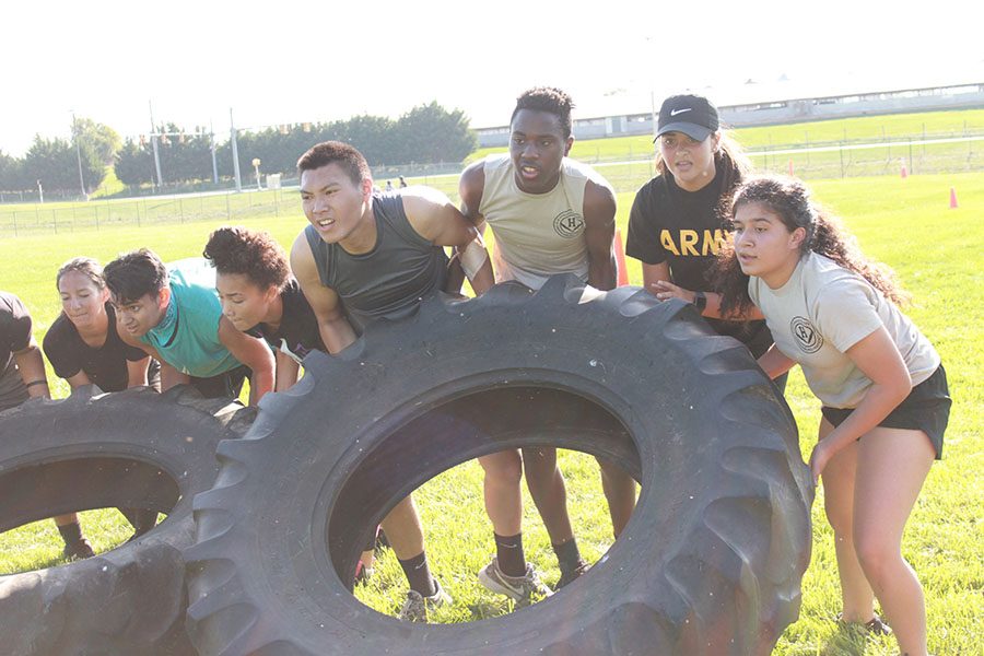 C team starts to flips tires as a for the team physical fitness  course. 