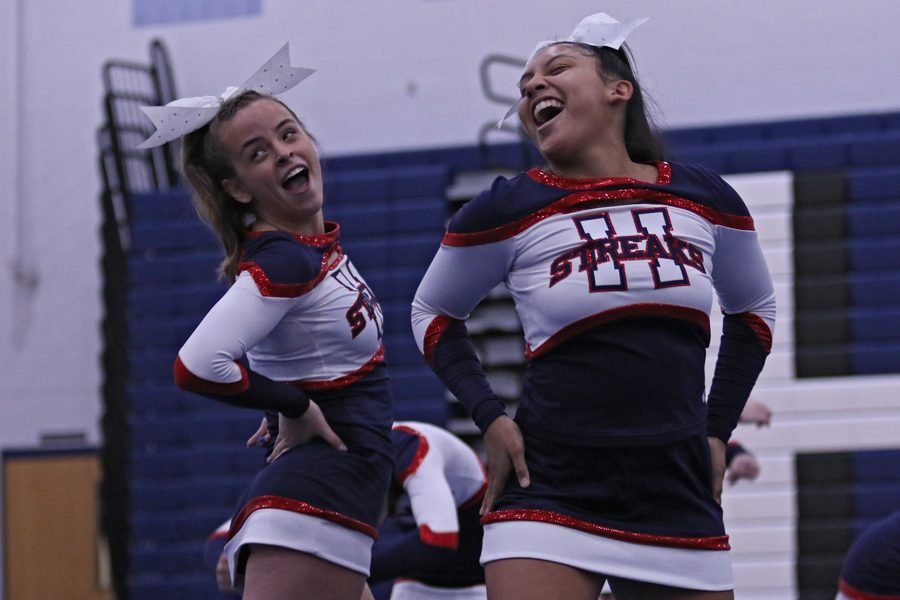 Sophomores Clara Miller and Genesis Martinez smile as they perform.